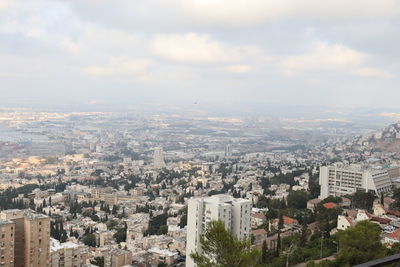 High angle view of city buildings against sky