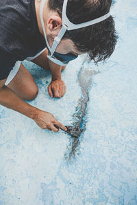 High angle view of man swimming in pool