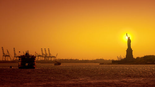 Statue of liberty against sky during sunset