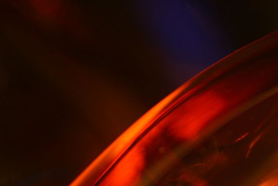 Low angle view of illuminated orange sky