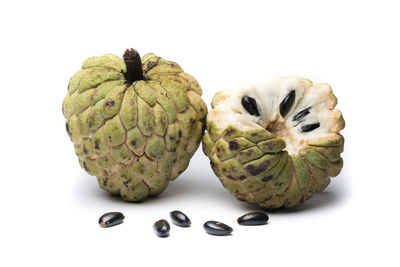 Close-up of fruits against white background