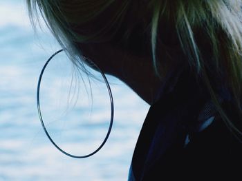 Cropped image of woman wearing large earring