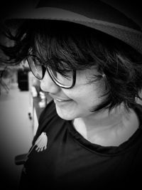 Close-up portrait of woman wearing hat