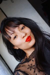 Portrait of beautiful woman with red lipstick