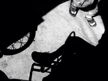 Low section of people standing on tiled floor