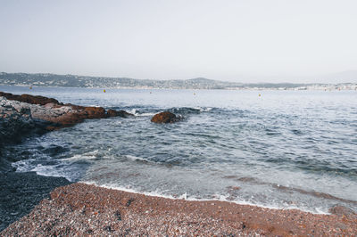 Scenic view of sea against clear sky