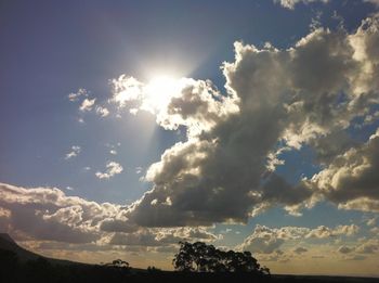 Sun shining through clouds