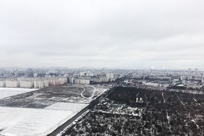 High angle view of buildings in city against sky