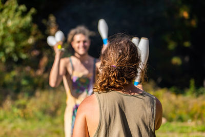 Rear view of couple holding hands