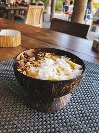 High angle view of ice cream in basket on table