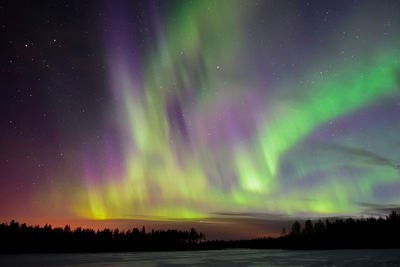 Low angle view of dramatic sky at night