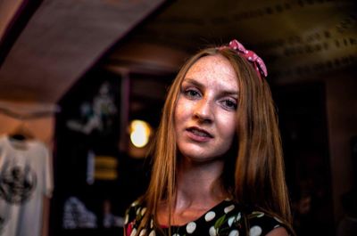 Portrait of a young woman looking away