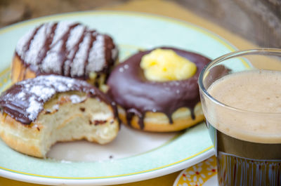 Bitten donut with coffee