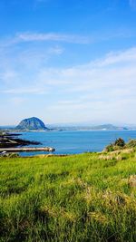 Scenic view of mountains against cloudy sky