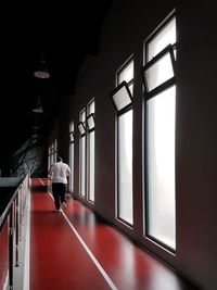 Man in illuminated corridor
