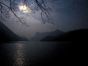 Scenic view of calm lake against mountain range