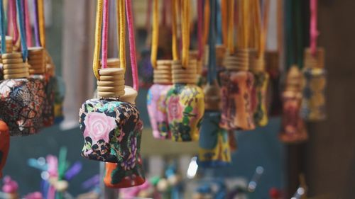 Close-up of decorative materials hanging for sale