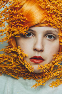 Close-up portrait of woman in autumn