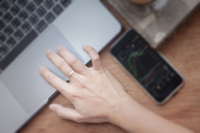 High angle view of man using laptop on table