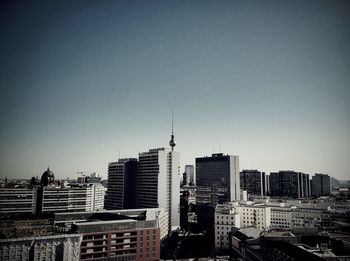 Skyscrapers in city against clear sky