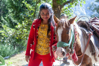 A teenage girl treking through kedarnath wildlife sanctuary