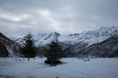 Scenic view of snow covered mountains against sky