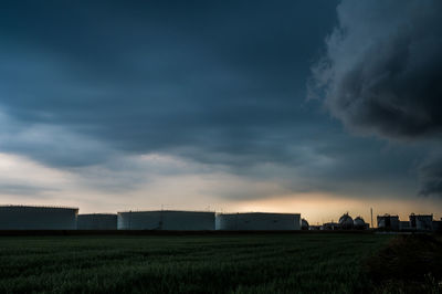 Storm clouds over crossbridge energy fredericia refinery, denmark