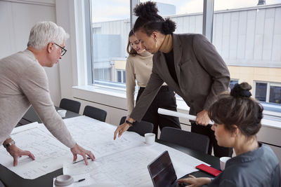 People having meeting in office