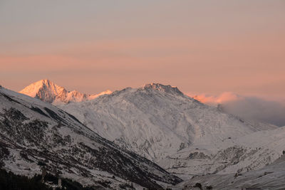 Sunrise at the peaks of the matterhorm mountain range in the alps.