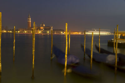 Illuminated building against sky at night