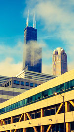 Low angle view of building against cloudy sky