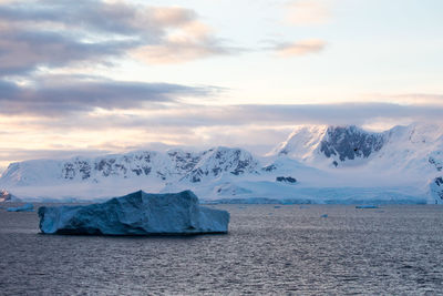 Scenic view of snowcapped landscape against sky during winter