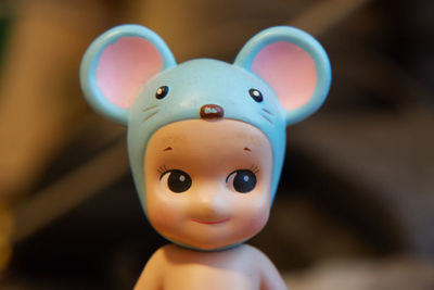 Close-up of toy figurine on wood