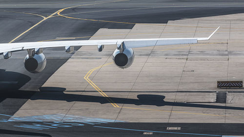 High angle view of airplane on airport runway