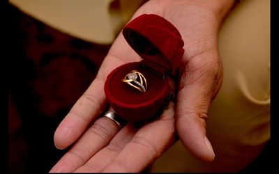 Engagement ring on woman's finger, closeup.