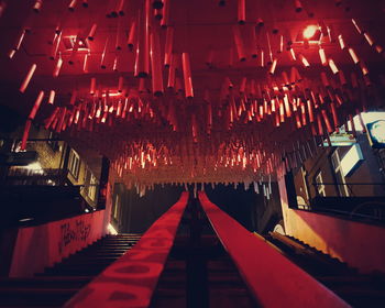 Close-up of illuminated lanterns hanging at night