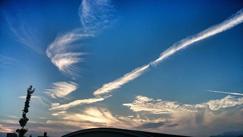 Low angle view of vapor trails in sky