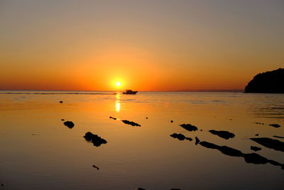 Scenic view of sea against sky during sunset