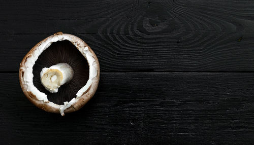 High angle view of mushroom on table. overhead, copy space, black.