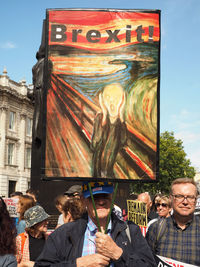 Portrait of people standing in front of building