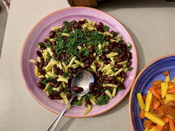 High angle view of chopped vegetables in bowl on table