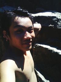 Close-up portrait of young woman in water