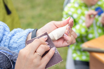 Close-up of woman holding hands