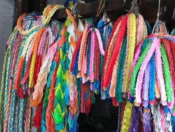 Multi colored flags hanging for sale at market stall