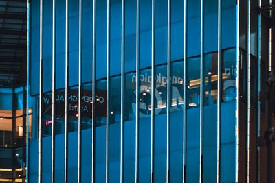 Modern building seen through metal fence