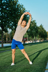 Full length of man exercising at park