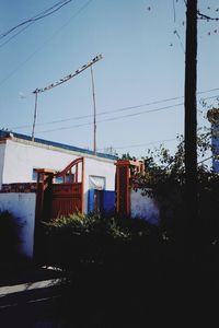 Buildings against clear blue sky