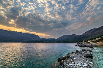 Scenic view of lake against sky during sunset