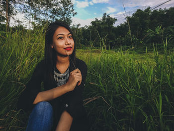 Young woman in grass