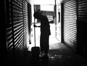 Woman standing in corridor